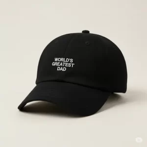 Black cotton dad hat with white "World’s Greatest Dad" embroidery, curved brim and adjustable strap